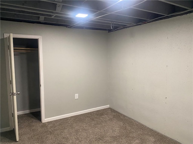 finished basement featuring carpet flooring and baseboards