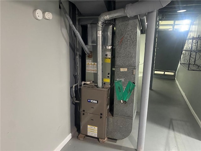 utility room featuring heating unit