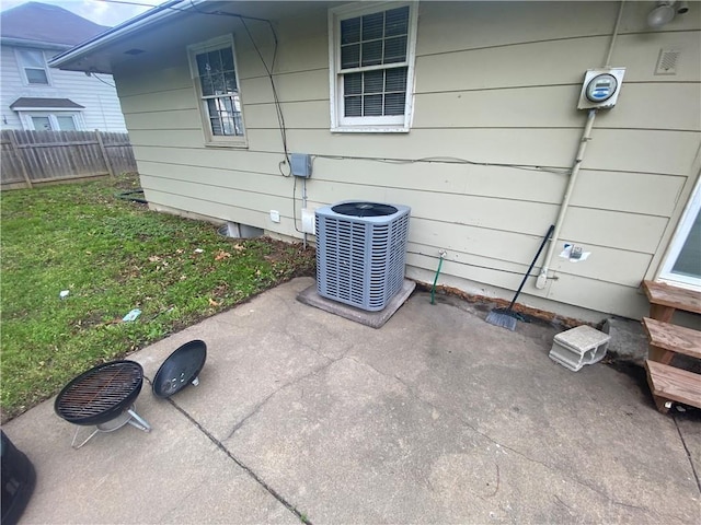 details with central air condition unit and fence