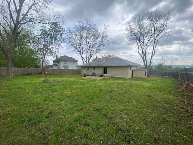 view of yard with a patio and a fenced backyard