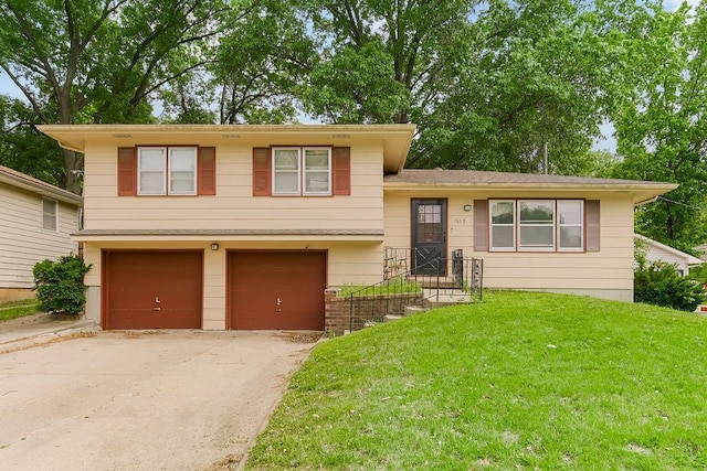1835 Miami St, Leavenworth, KS 66048 - tri-level home featuring an attached garage, driveway, and a front lawn