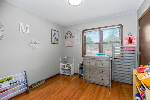 1835 Miami St, Leavenworth, KS 66048 - rec room with light wood-style floors