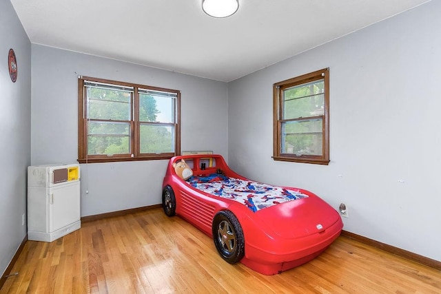 1835 Miami St, Leavenworth, KS 66048 - bedroom featuring wood finished floors and baseboards