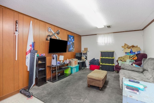 1835 Miami St, Leavenworth, KS 66048 - living area with a textured ceiling, concrete flooring, and wood walls