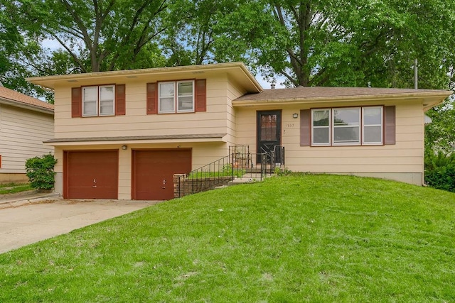 1835 Miami St, Leavenworth, KS 66048 - tri-level home featuring a garage, driveway, and a front yard