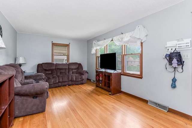 1835 Miami St, Leavenworth, KS 66048 - living room with light wood-style flooring and baseboards