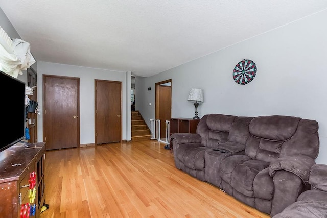 1835 Miami St, Leavenworth, KS 66048 - living area with wood finished floors and stairway