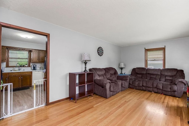 1835 Miami St, Leavenworth, KS 66048 - living area with light wood-style floors and baseboards