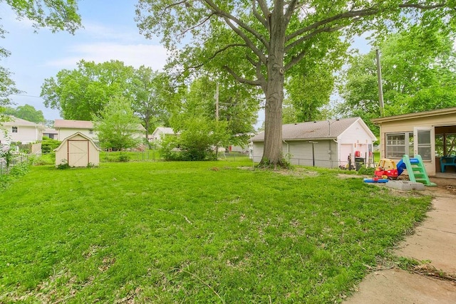 1835 Miami St, Leavenworth, KS 66048 - fenced backyard featuring a storage unit and a sunroom