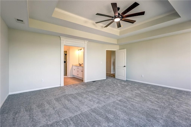 24108 W 67th Ter, Shawnee, KS 66226 - unfurnished bedroom featuring a tray ceiling, crown molding, carpet flooring, and ensuite bathroom