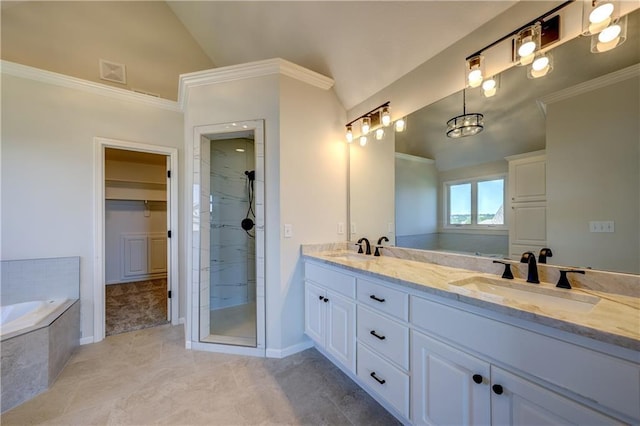 24108 W 67th Ter, Shawnee, KS 66226 - bathroom featuring lofted ceiling, double vanity, a bath, a shower stall, and tile patterned floors