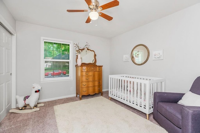 2427 N 83rd Ln, Kansas City, KS 66109 - bedroom with carpet, a closet, a nursery area, ceiling fan, and baseboards