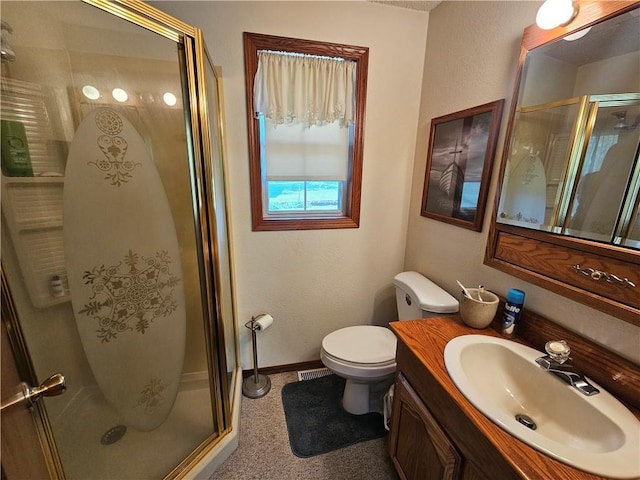 bathroom featuring a shower stall, toilet, vanity, baseboards, and visible vents