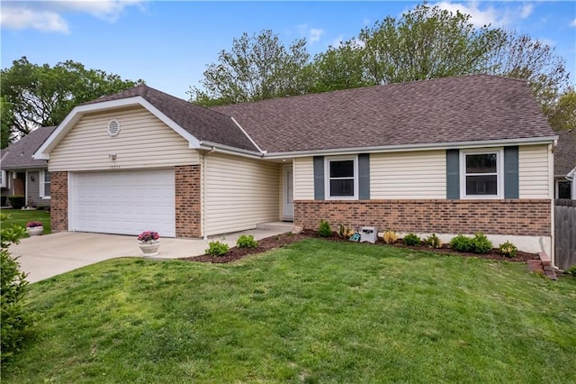 single story home with brick siding, a garage, a front yard, and concrete driveway