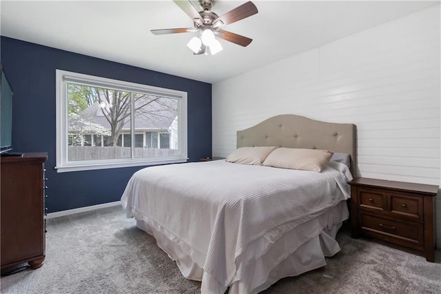 carpeted bedroom with baseboards and ceiling fan