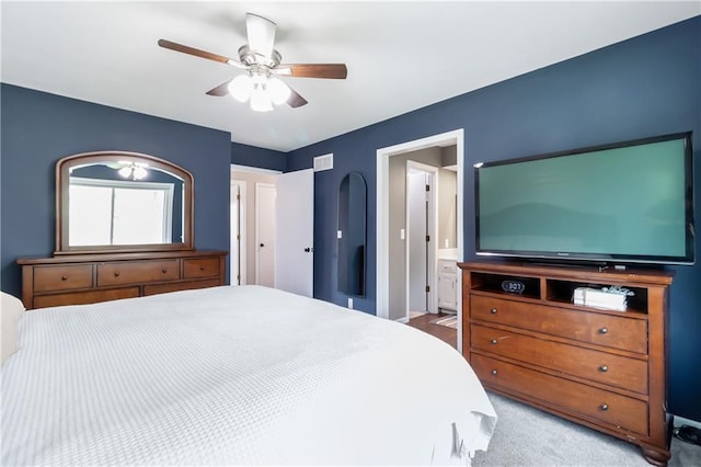 bedroom with ceiling fan, carpet, connected bathroom, and visible vents