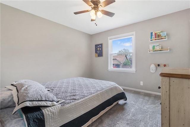 carpeted bedroom with baseboards and ceiling fan