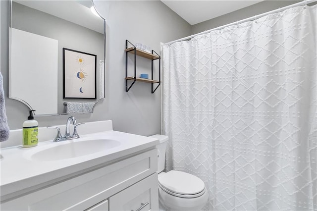 bathroom with vanity, toilet, and a shower with shower curtain