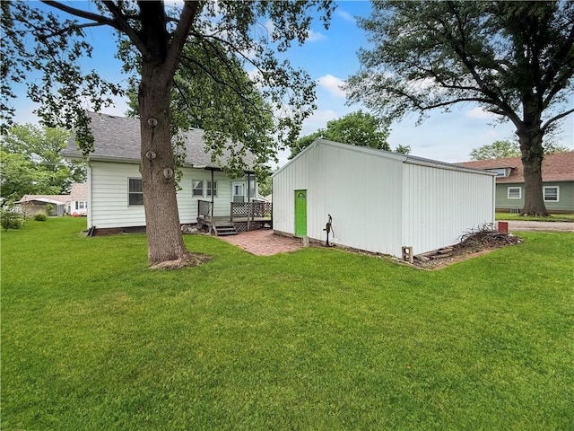 601 W 22nd St, Higginsville, MO 64037 - rear view of property with a lawn and an outbuilding