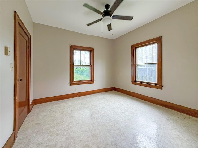 601 W 22nd St, Higginsville, MO 64037 - spare room with baseboards and ceiling fan