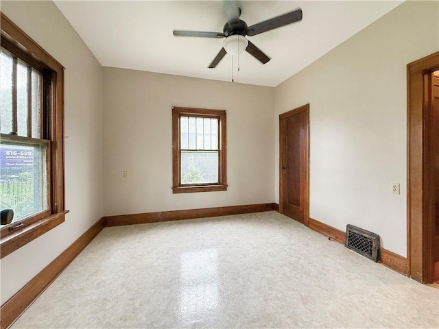 601 W 22nd St, Higginsville, MO 64037 - spare room featuring baseboards and ceiling fan