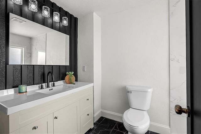 bathroom with baseboards, visible vents, toilet, and marble finish floor