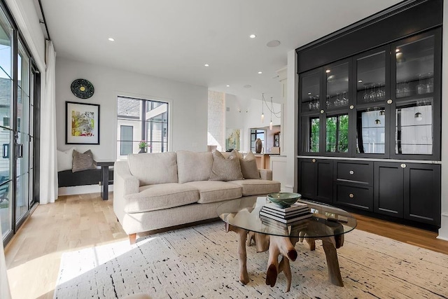 living area featuring recessed lighting and light wood-type flooring