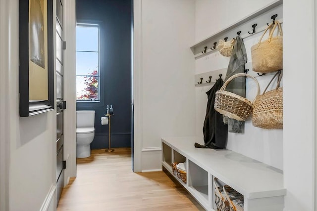 mudroom featuring baseboards and light wood-style flooring