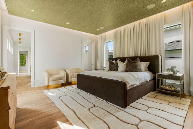 bedroom featuring recessed lighting and wood finished floors