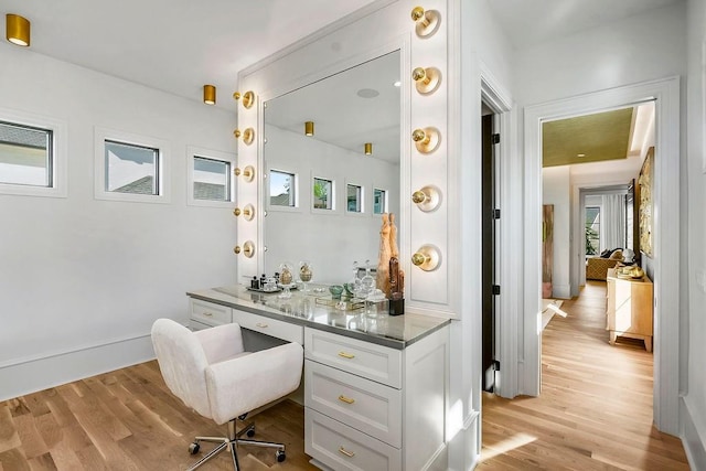 home office with light wood-style flooring