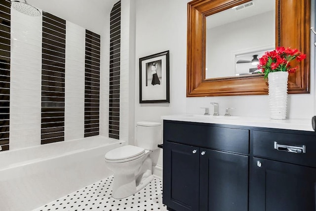 bathroom with toilet, tile patterned floors, visible vents, and vanity