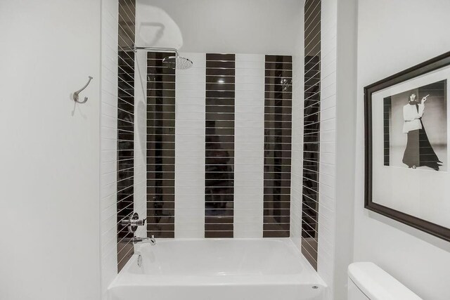 full bath featuring shower / bath combination and toilet