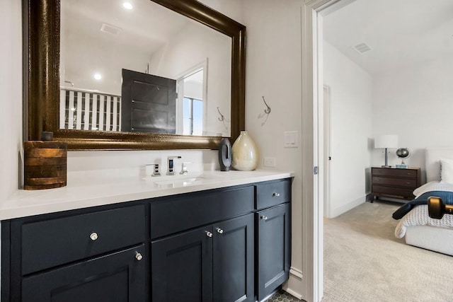 bathroom featuring vanity and baseboards