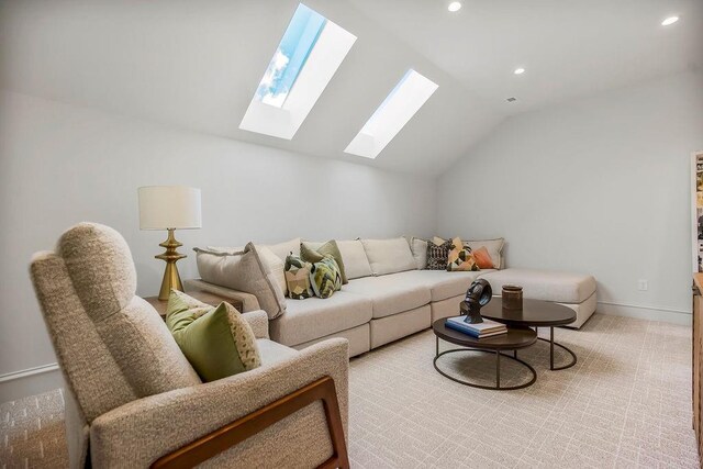 living room with recessed lighting, baseboards, and lofted ceiling with skylight