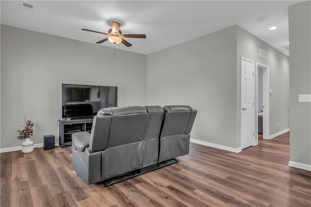 living area with visible vents, baseboards, recessed lighting, wood finished floors, and a ceiling fan