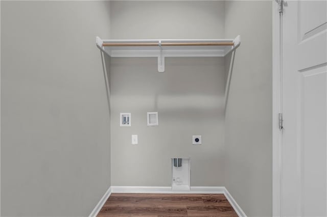 clothes washing area featuring electric dryer hookup, baseboards, hookup for a washing machine, wood finished floors, and laundry area