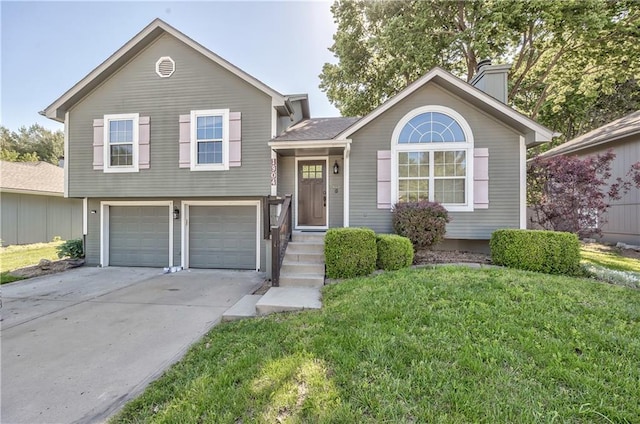 1904 NW Harbor Pl, Blue Springs, MO 64015 - tri-level home with an attached garage, a chimney, a front lawn, and driveway