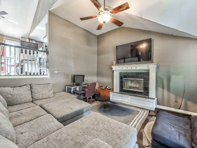 1904 NW Harbor Pl, Blue Springs, MO 64015 - living room featuring a ceiling fan, lofted ceiling, and a tile fireplace