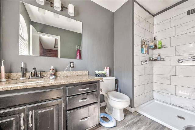 1904 NW Harbor Pl, Blue Springs, MO 64015 - bathroom with toilet, vanity, a stall shower, and wood finished floors