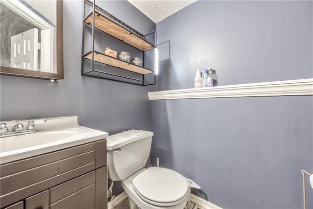 1904 NW Harbor Pl, Blue Springs, MO 64015 - half bath featuring toilet, a textured ceiling, vanity, and baseboards