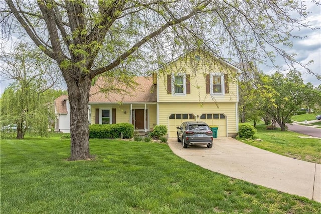 split level home featuring a garage, concrete driveway, and a front yard