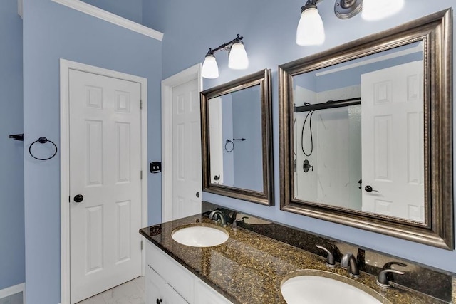 bathroom featuring a sink, crown molding, and double vanity