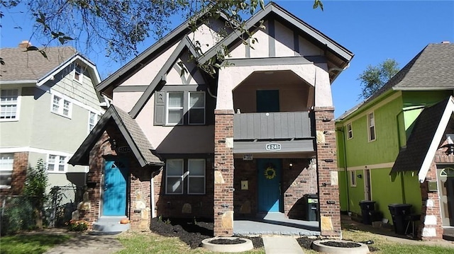 view of front of property with stucco siding and brick siding