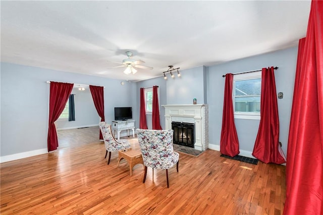 314 N Lake St, Pleasant Hill, MO 64080 - living area with light wood-style floors, a ceiling fan, and a wealth of natural light
