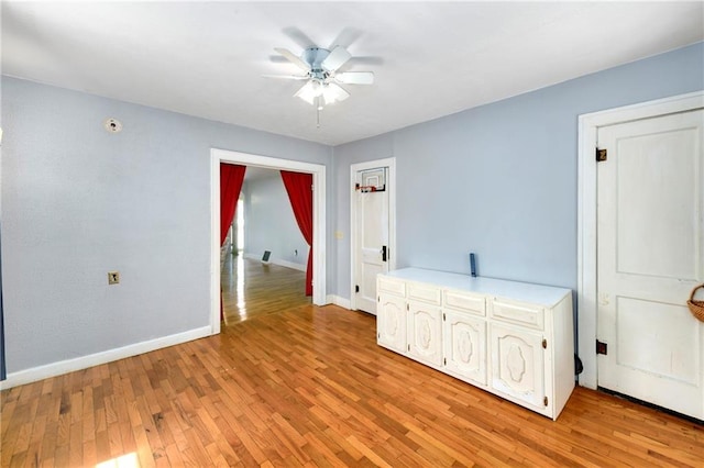 314 N Lake St, Pleasant Hill, MO 64080 - spare room featuring baseboards, a ceiling fan, and light wood-type flooring