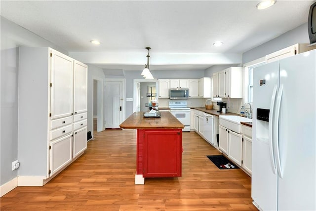 314 N Lake St, Pleasant Hill, MO 64080 - kitchen featuring white appliances, recessed lighting, white cabinets, and a sink