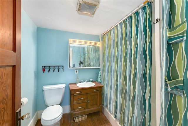 314 N Lake St, Pleasant Hill, MO 64080 - full bathroom with vanity, wood finished floors, toilet, baseboards, and a shower with curtain