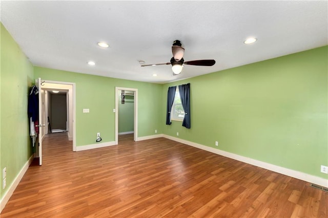 314 N Lake St, Pleasant Hill, MO 64080 - unfurnished bedroom featuring recessed lighting, wood finished floors, and visible vents