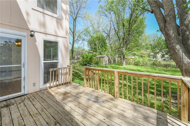 314 N Lake St, Pleasant Hill, MO 64080 - wooden terrace featuring an outdoor structure, a yard, and a shed