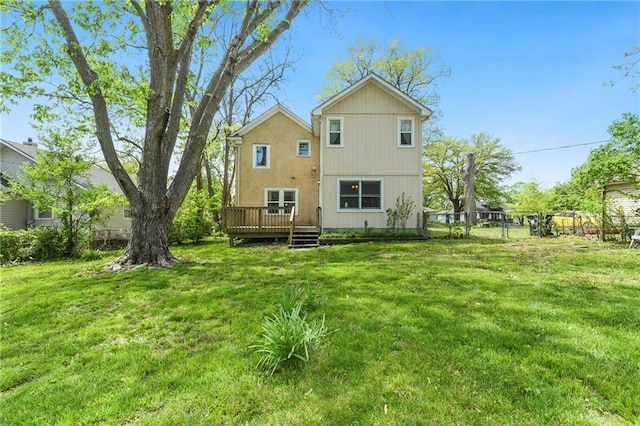 314 N Lake St, Pleasant Hill, MO 64080 - back of property with fence, a yard, and a deck
